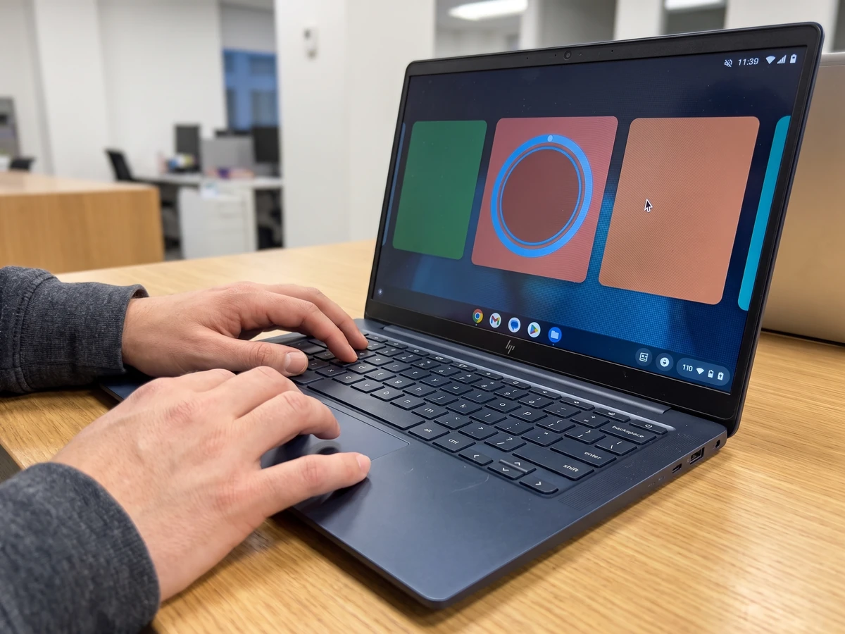 Googlebook adaptive Android app guide: stop stretching the phone layout 2 Googlebook adaptive Android app: hands testing keyboard pointer and touch targets on an adaptive Android laptop app